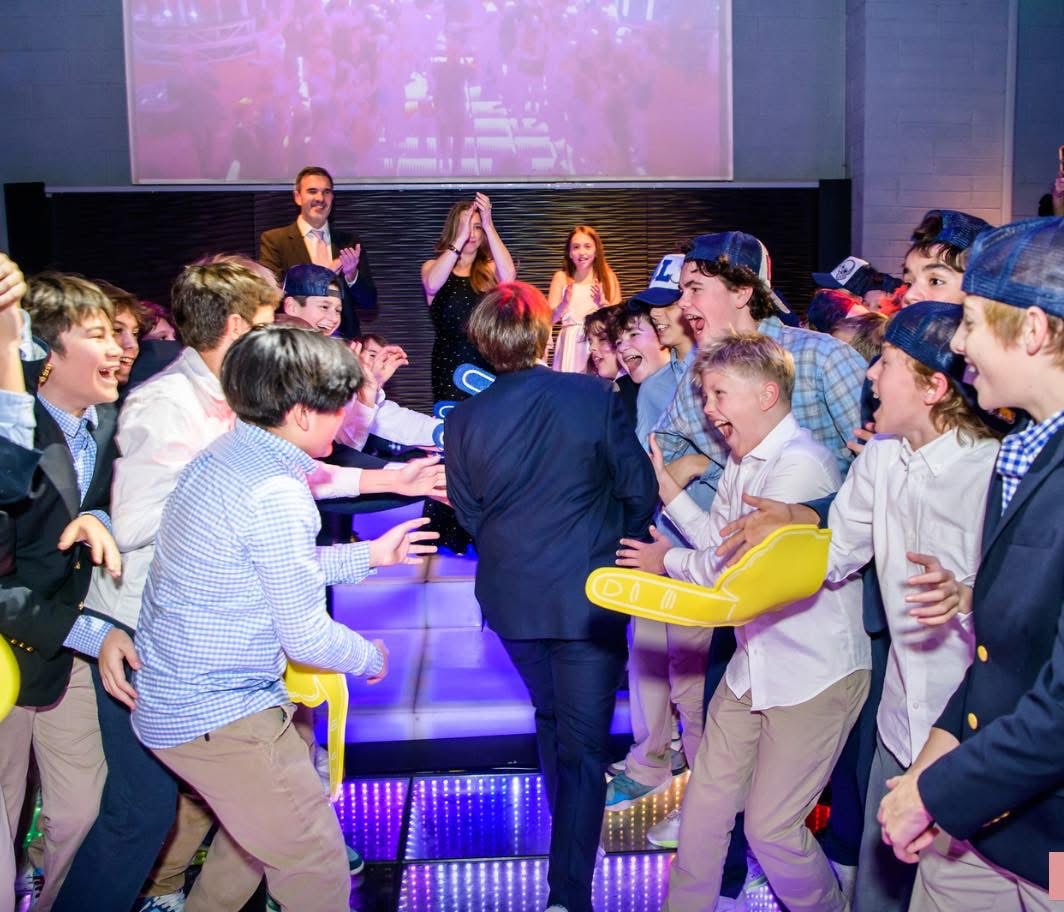 Hamish dancing among friends at a celebration