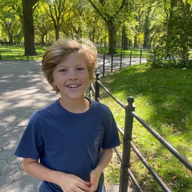Hamish smiling in a park