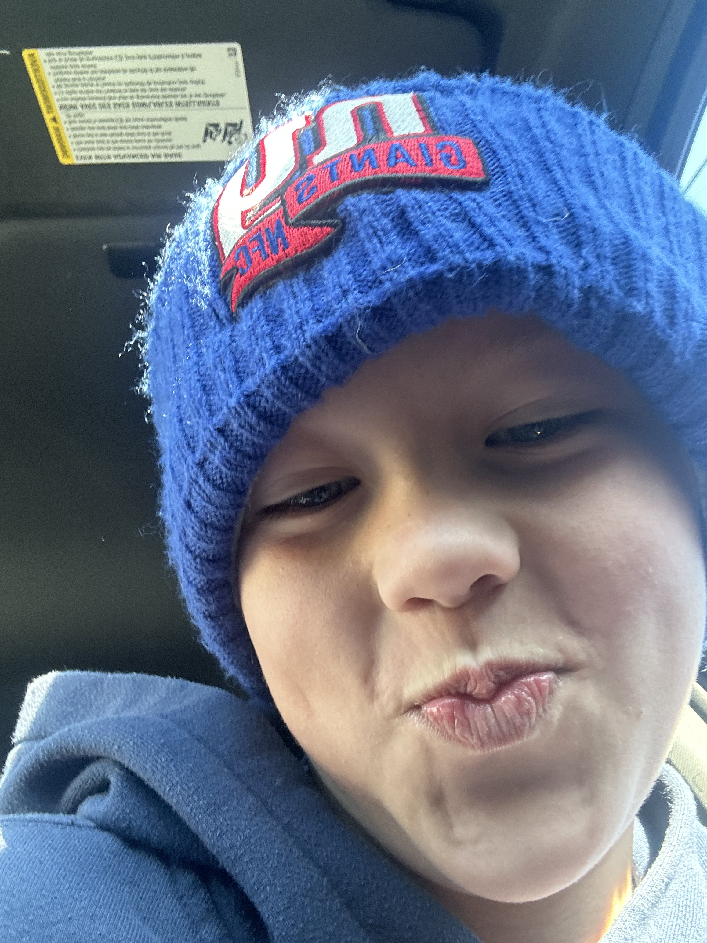 Hamish wearing a Hamish Strong beanie with family