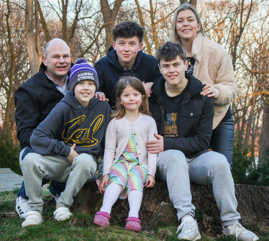 Hamish with family outdoors